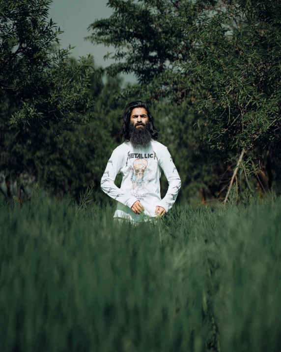 an afro american man is standing in the middle of a field