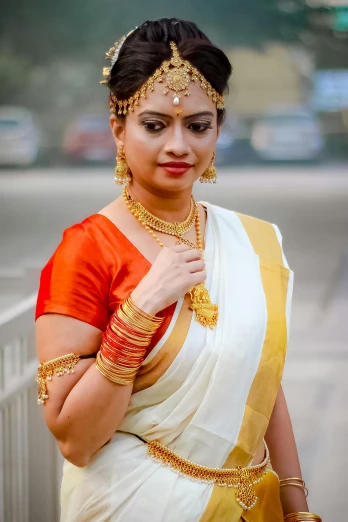 a woman dressed in an indian garbana