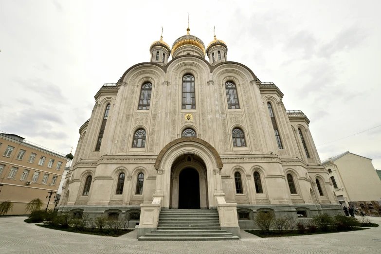 a large building with two towers and three steps