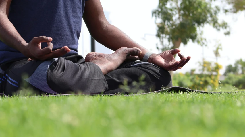 the person with one hand extended is doing yoga