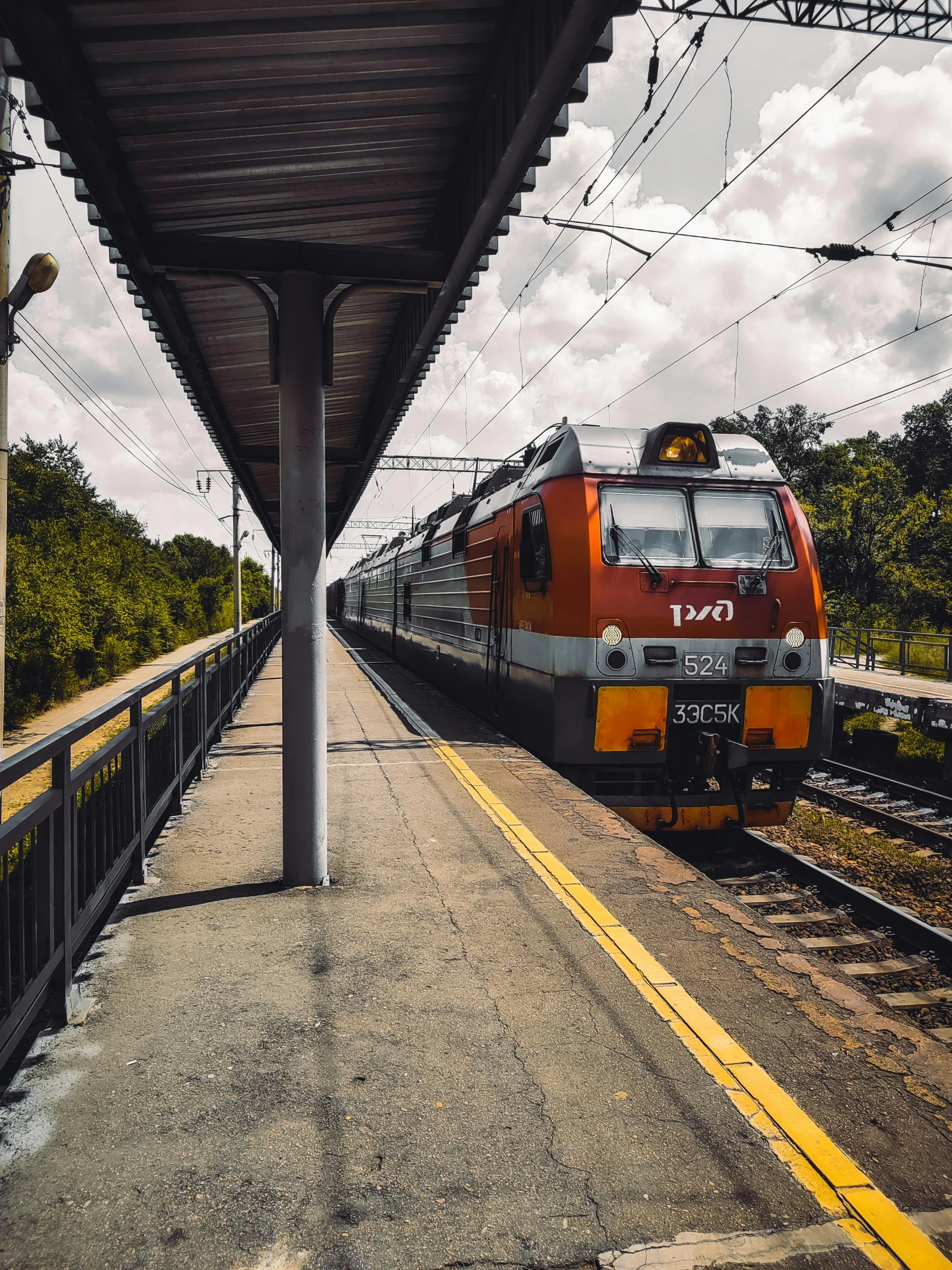 a train that is sitting on the tracks near a platform