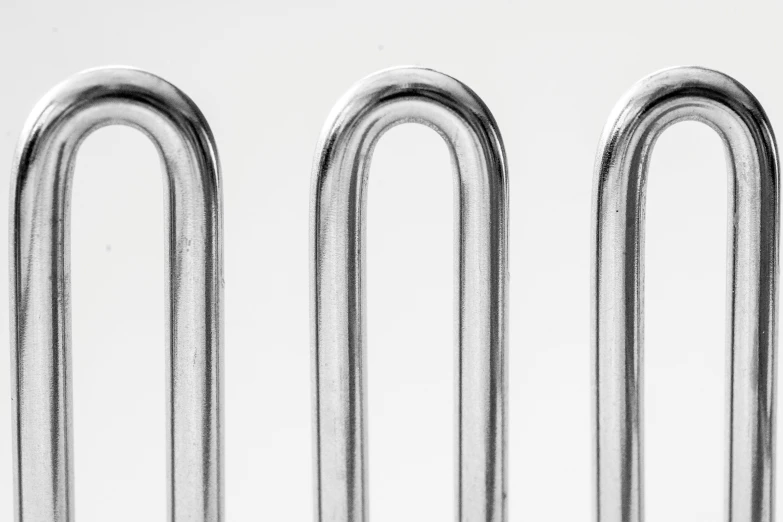 a close up of four different types of paper clips