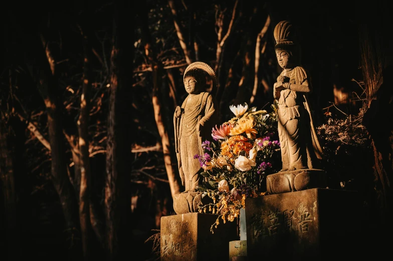 flowers in vases are arranged on a grave