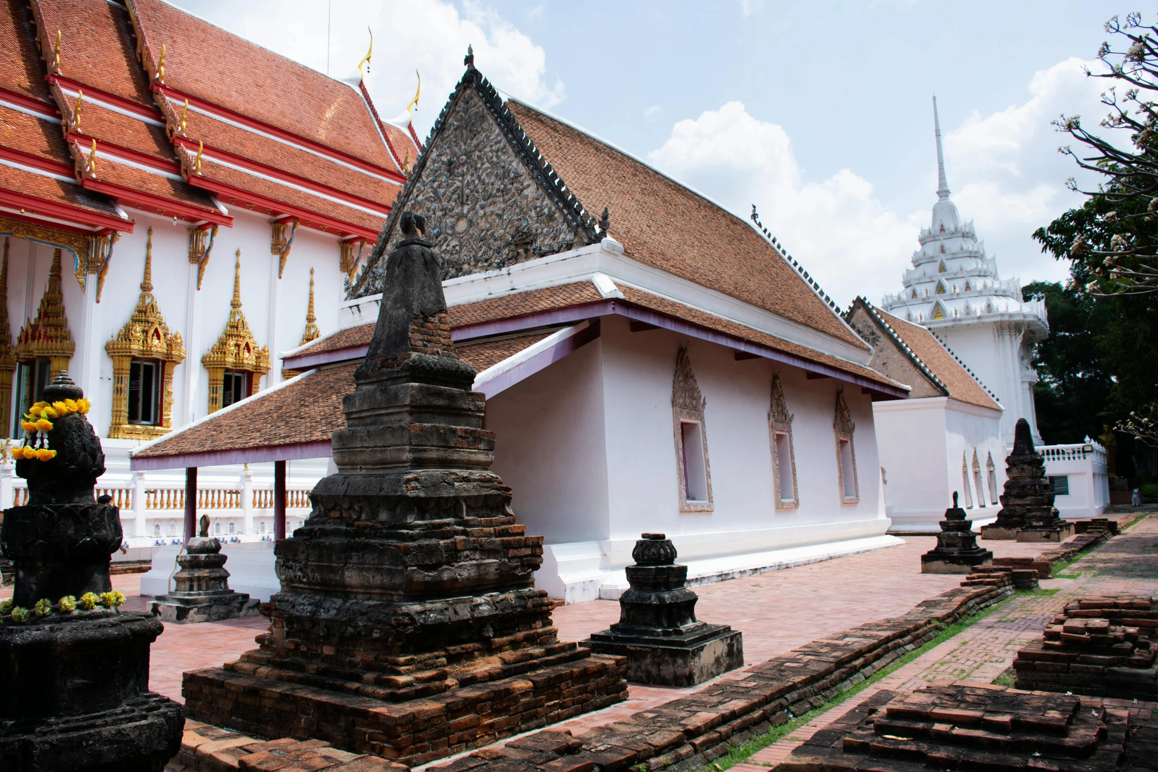 several small statues in front of an ornate building