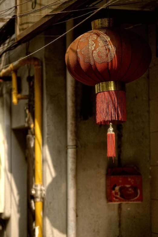 a bunch of red lamps hanging outside