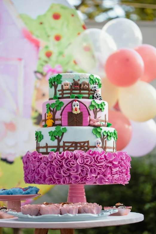 a colorful cake with a horse themed decoration