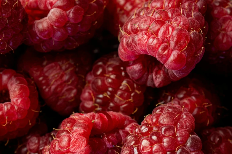 large group of raspberries all grouped together