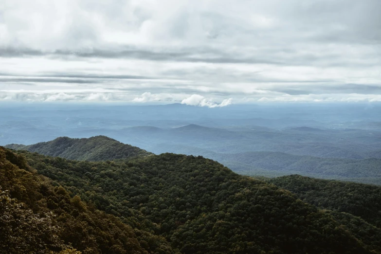 view of a mountain range and hills from above