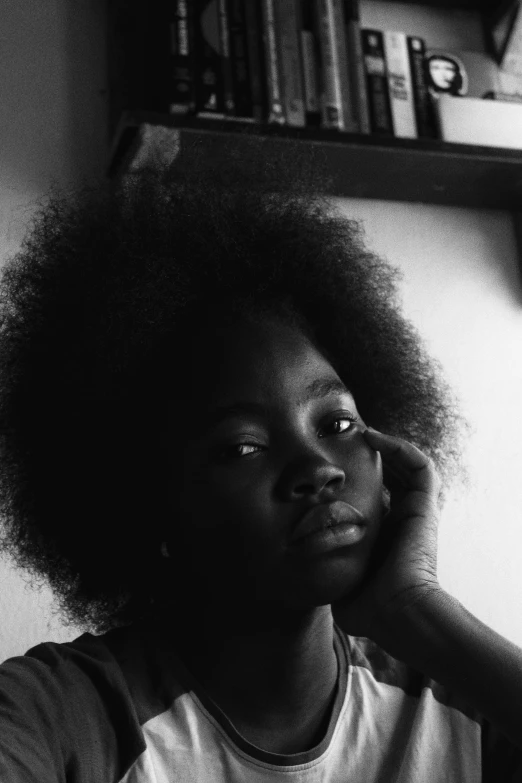 a young woman with afro and eye shadow