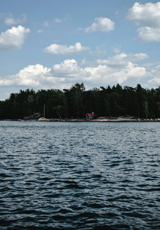 the view of an island from across a lake