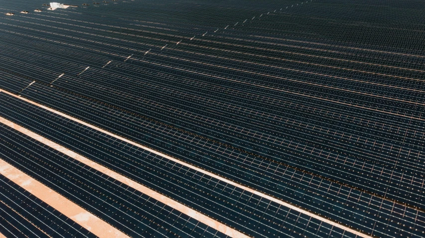 an aerial view of rows of solar panels