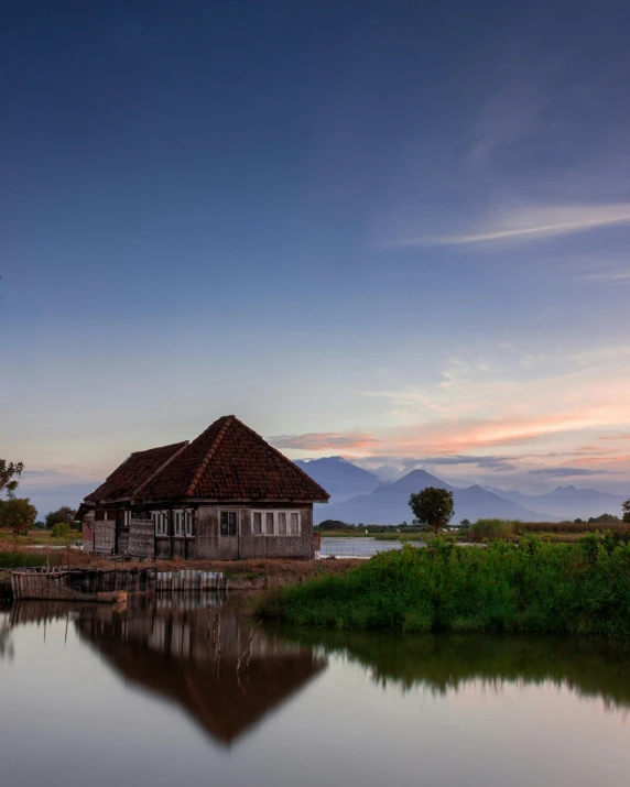 the house sits at the lake's end next to the small pier