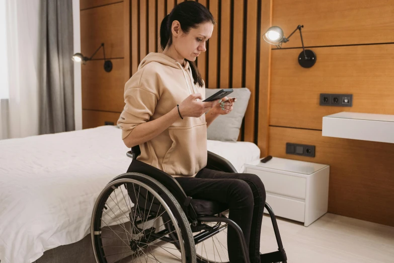 there is a woman in a wheelchair reading a paper