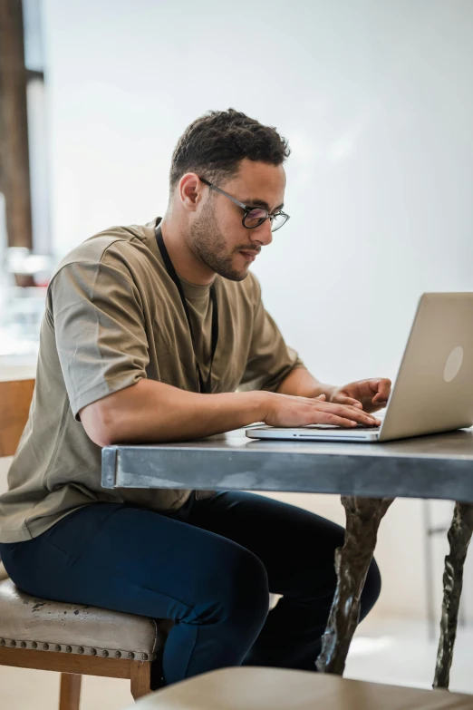 man working on his laptop in an office