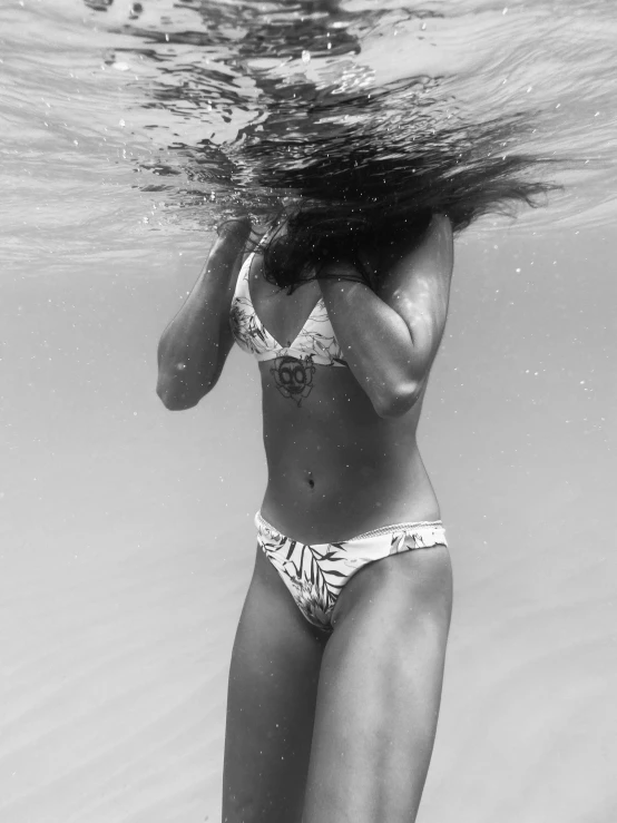 the woman in a bikini under the water