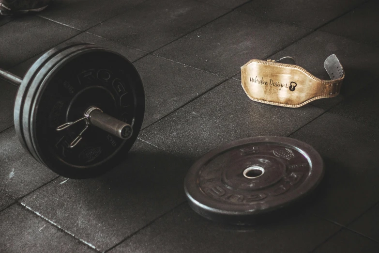 a barbell and weight in a gym