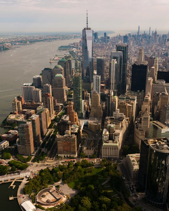 an aerial view of a city next to the ocean