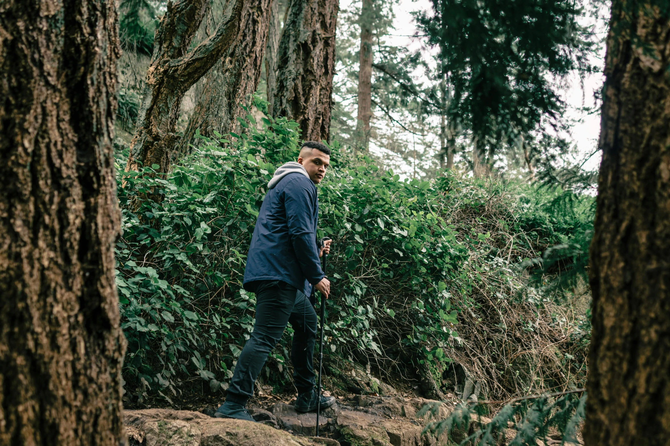 a man that is standing in the dirt