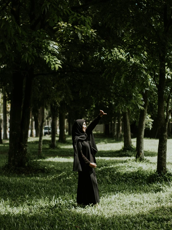 a nun throws the throwing stone for a nun in a wooded area