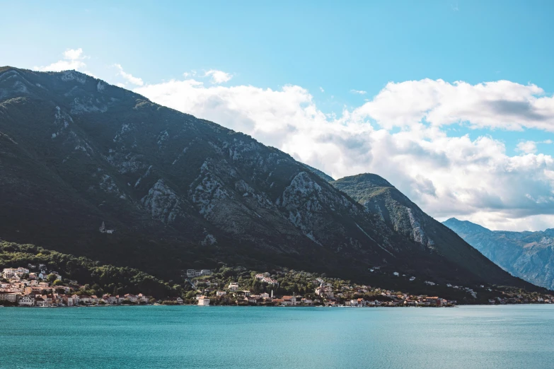 the view of an ocean and some mountains