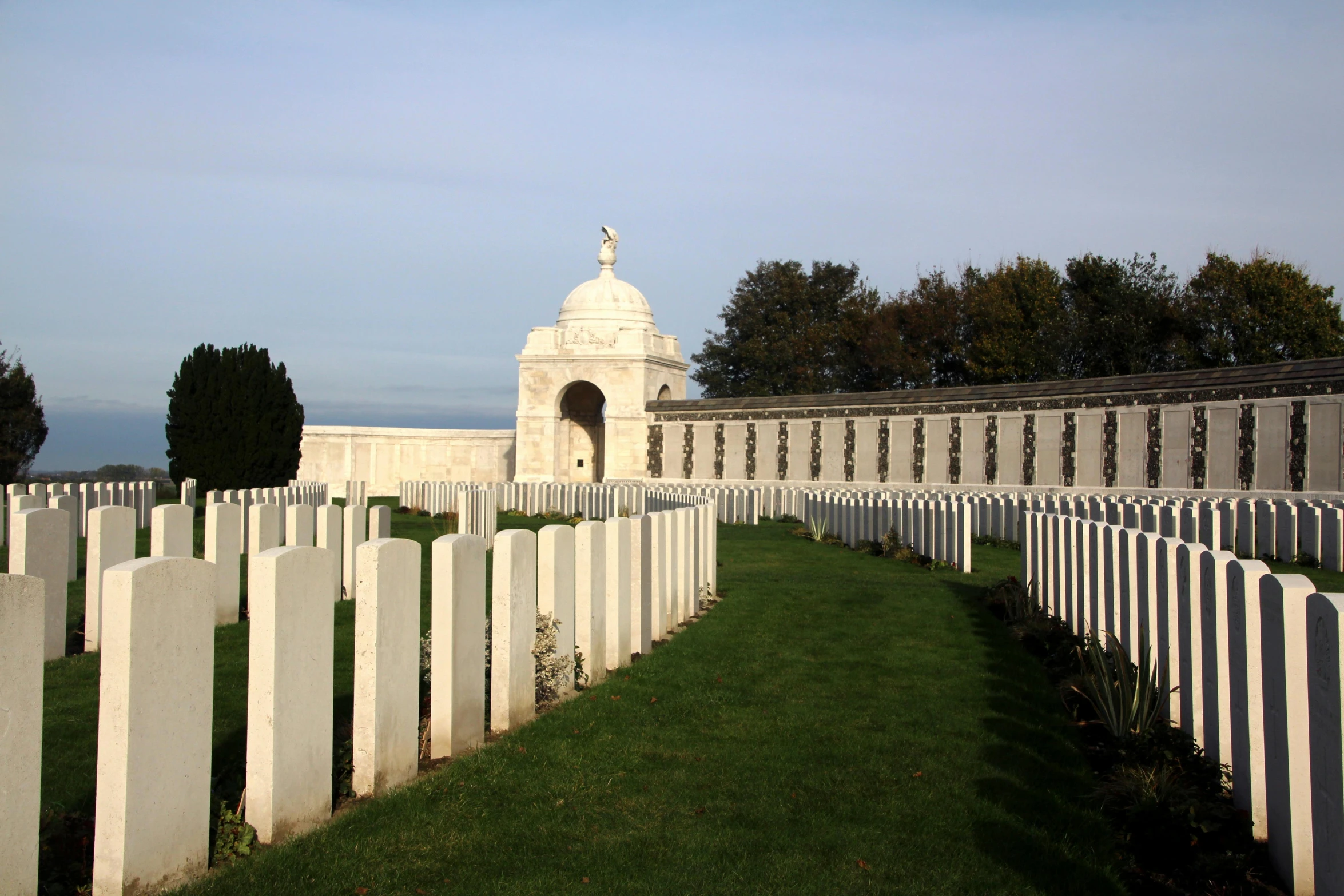 cemetery and gravestones on an open grassy area