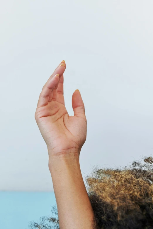 a persons hand holds up a cell phone