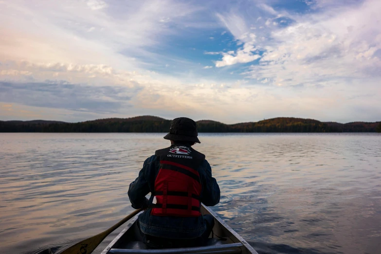 person sitting in a canoe with the view out