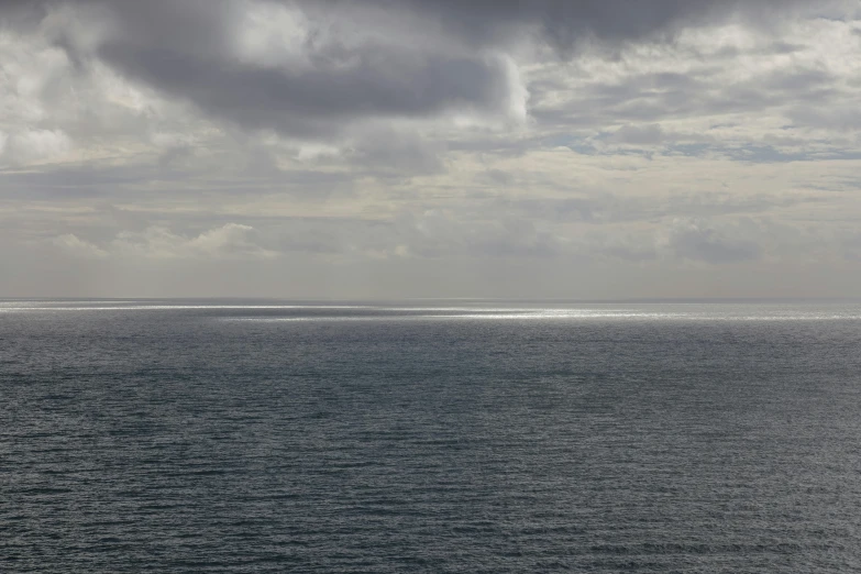 two people ride on a boat out on the water