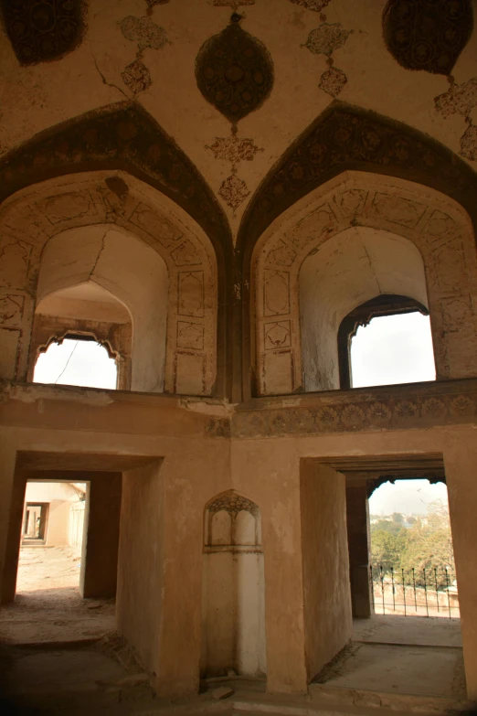 looking down from a two story ceiling, at a building with ornate walls