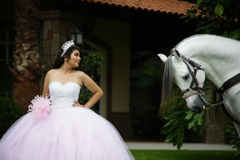 a woman is posing next to a horse