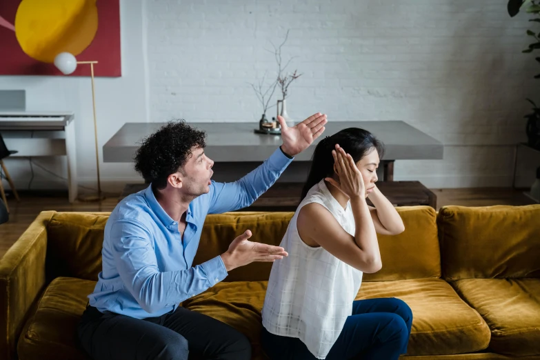 two people sitting on a couch with each other