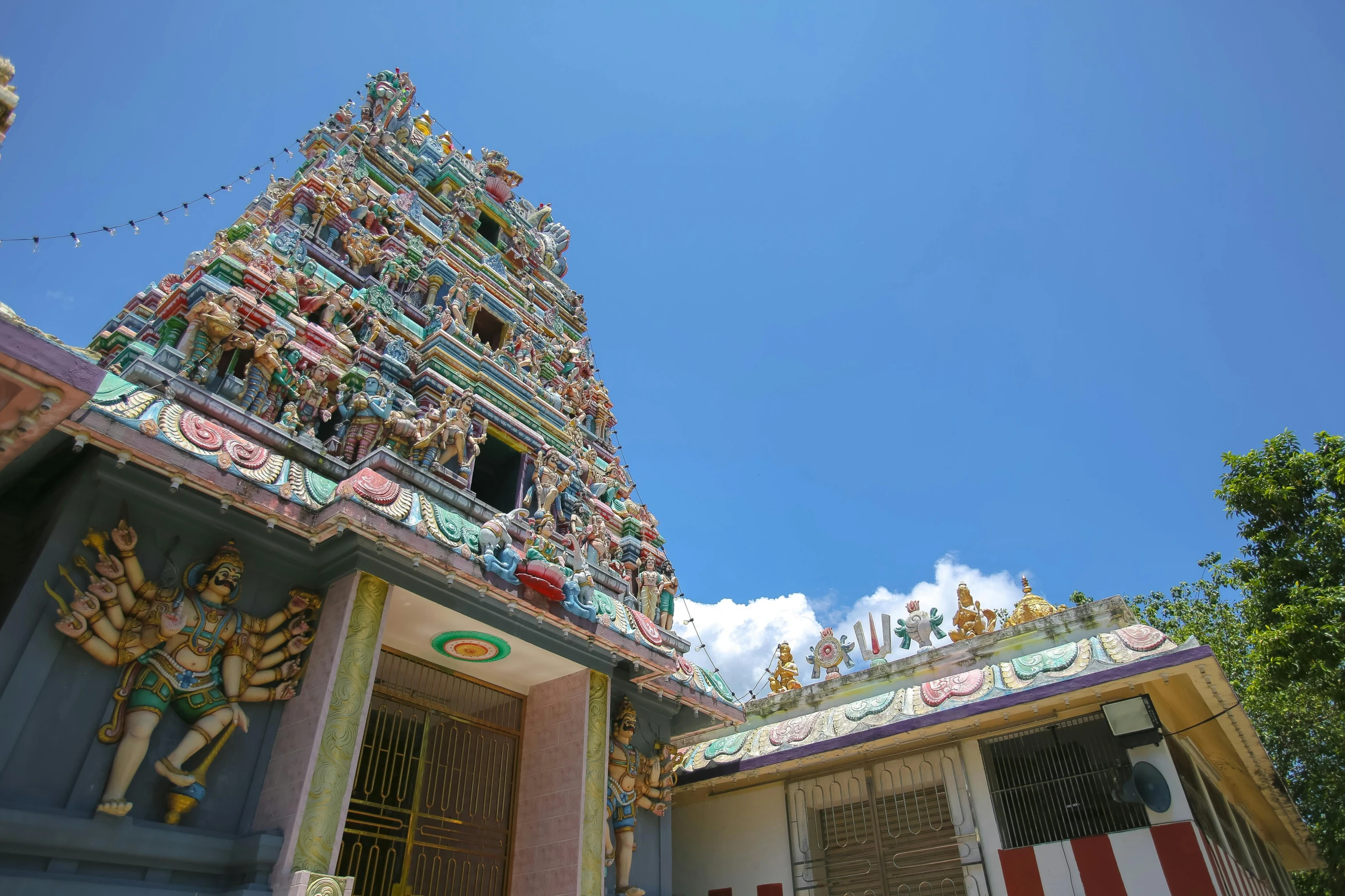 ornately painted buildings in india under a blue sky