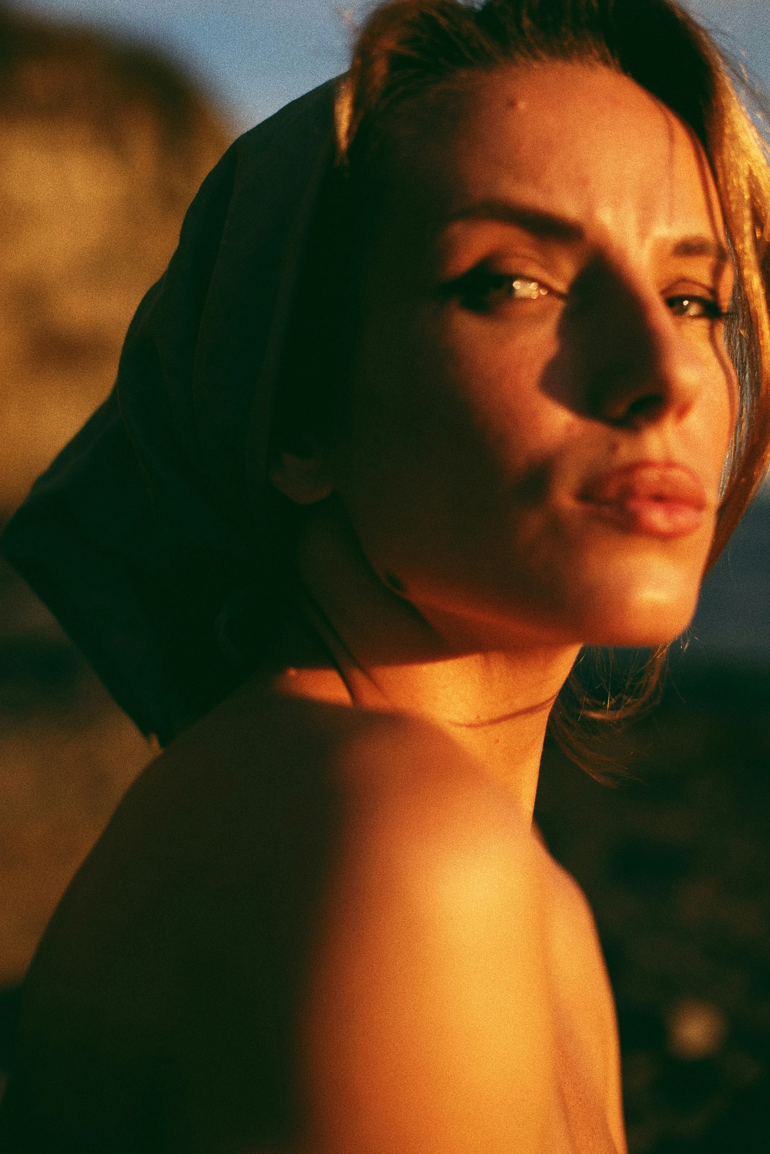 woman with her head on the ground wearing a towel