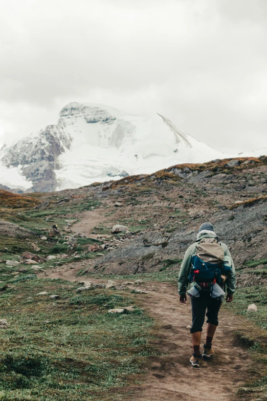 the person in the back is hiking up a hill