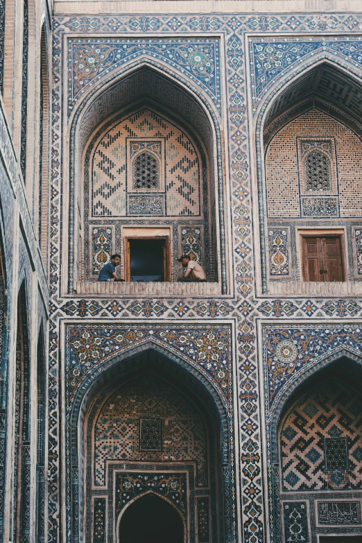 a blue tile and wood structure with carved windows