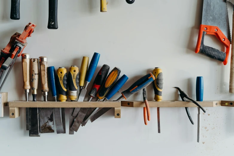 workbench and tools mounted to a wall