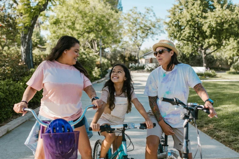 the man and two women are riding their bikes