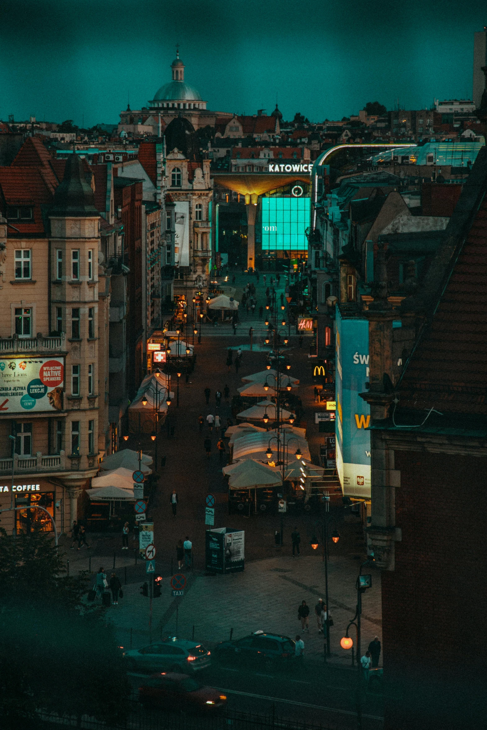 an overview from a building at night of a city