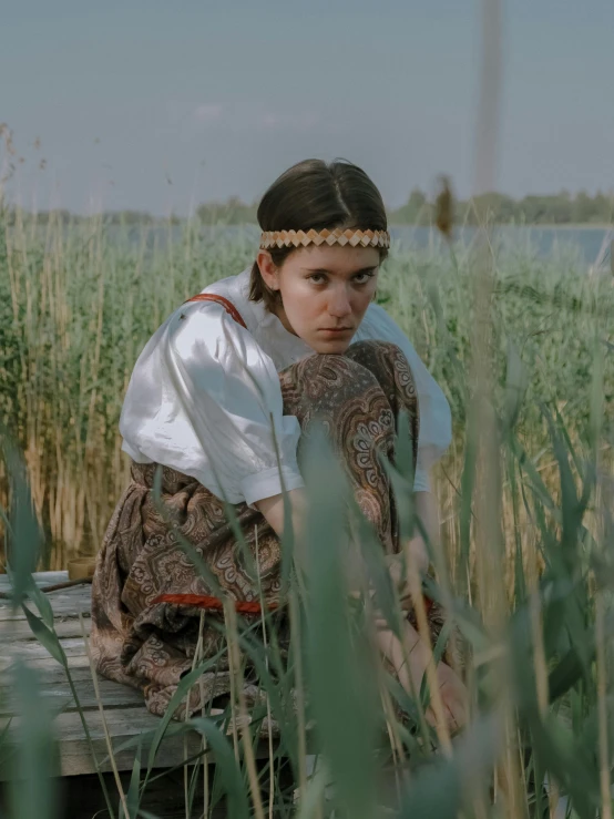 an old po shows a person sitting in grass