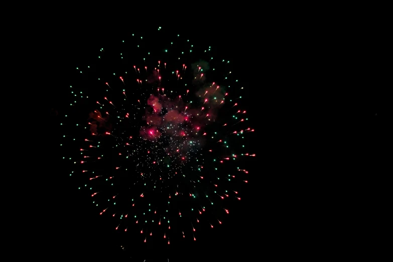 a colorful firework shows off at night