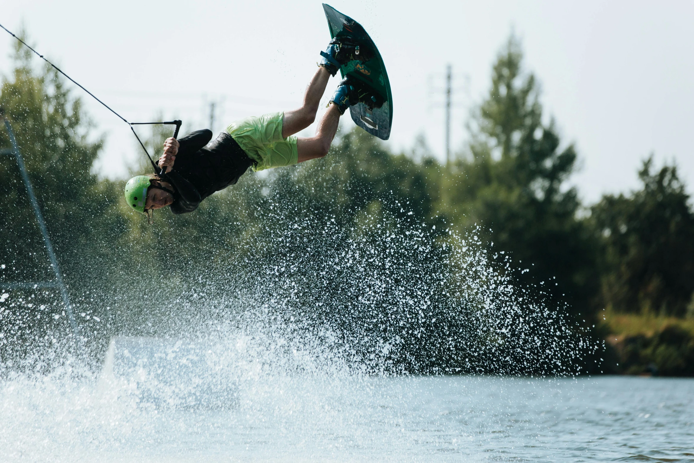 a woman water skiing on a lake while holding onto a handle