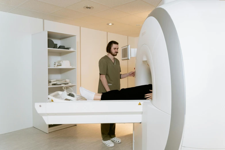 there is a man standing inside of an unusual refrigerator