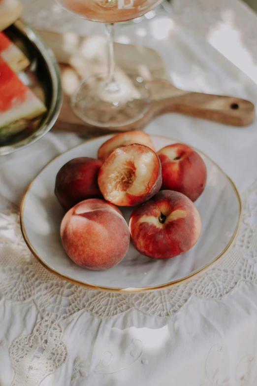 the plate is full of fruit and has four pieces of fruit on it