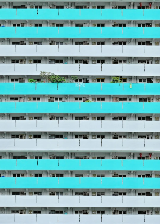 large multi story building with blue and grey lines