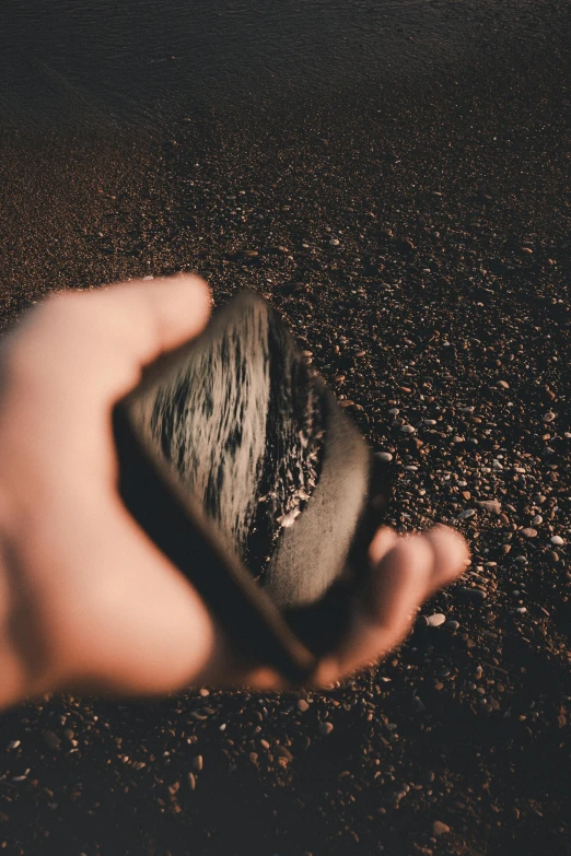 a small rock is sitting in the middle of the ground