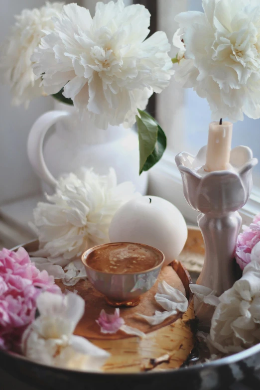 a cup of coffee with some flowers on it