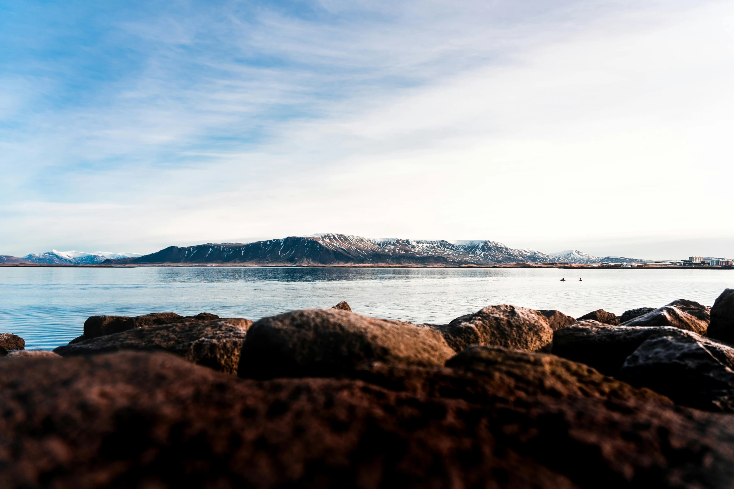 a body of water surrounded by large rocks