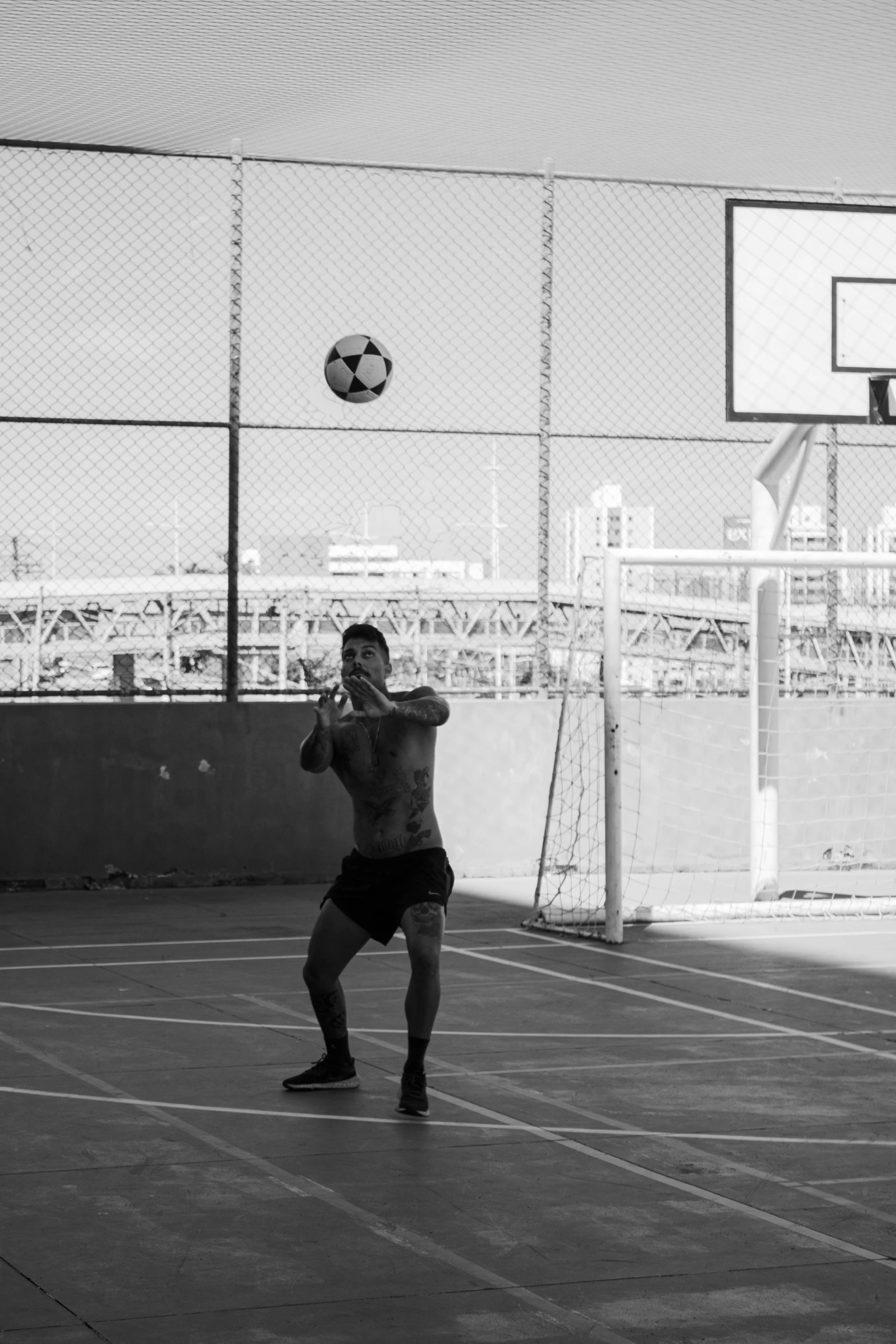 a man is kicking a ball around in a soccer field