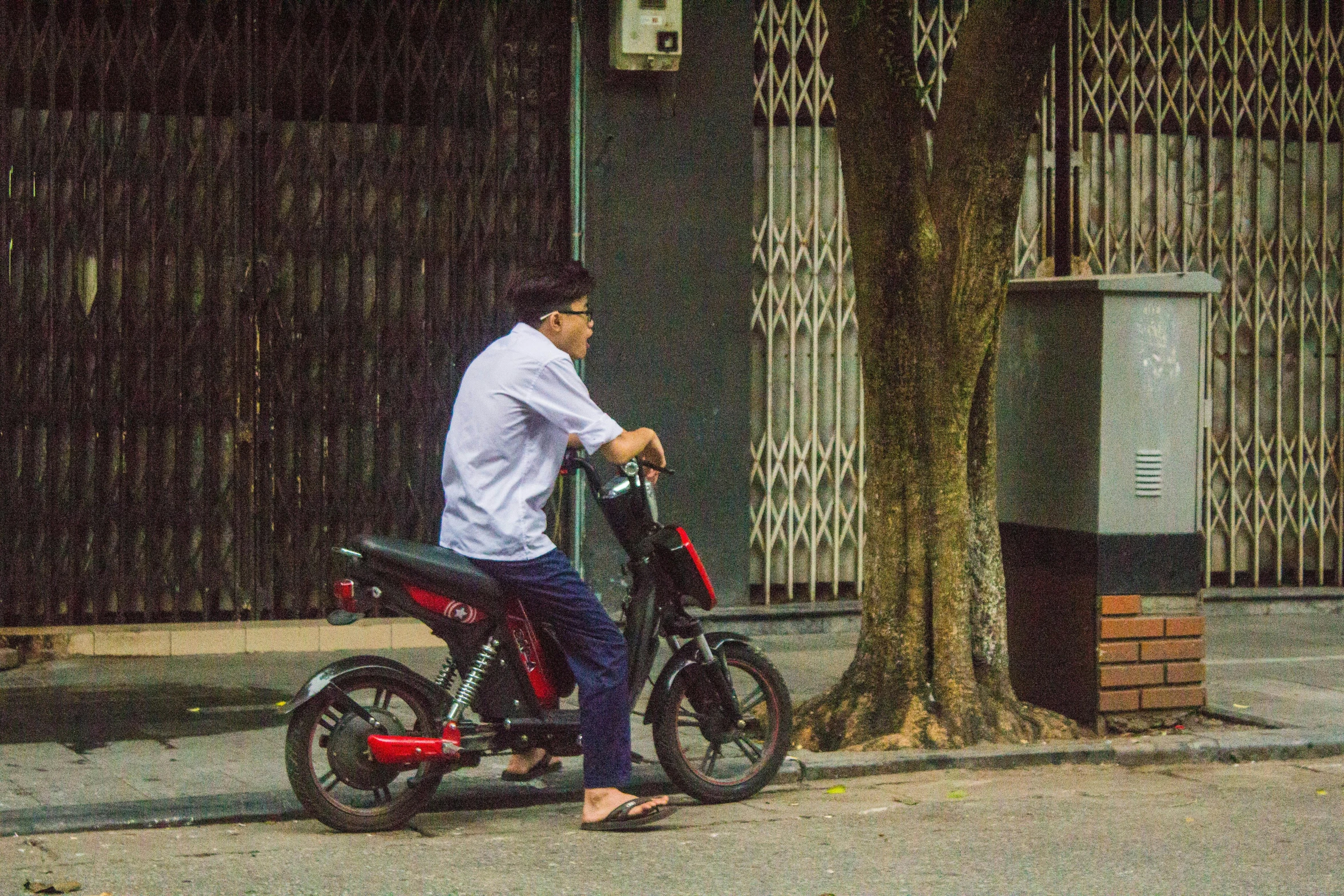 a person is riding a bicycle down the street