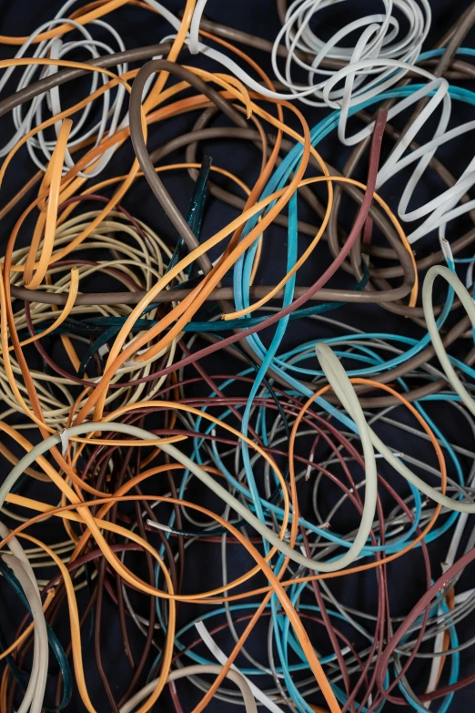 several rows of rubber bands are together on a blue background